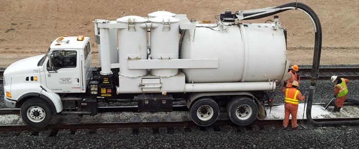 United Pumping Service performs onsite vacuum truck services for a railroad emergency spill response.