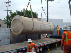 Onsite underground tank is placed on United Pumping Service equipment for transport to disposal facility.